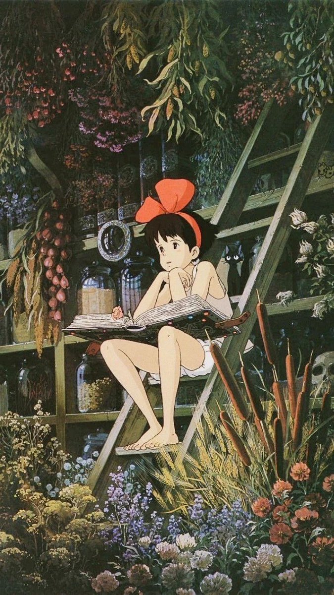 Kiki surrounded by flowers.